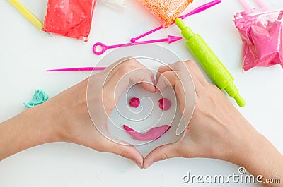 Child`s hands with colored plasticine. Stock Photo