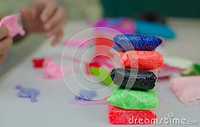 Child`s hands with colored plasticine. Stock Photo