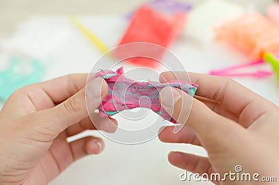 Child`s hands with colored plasticine. Stock Photo