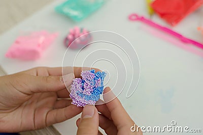 Child`s hands with colored plasticine. Stock Photo