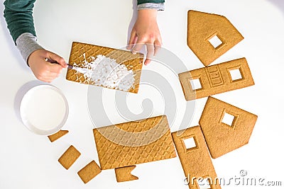 Child`s hands decorating gingerbread cookies, sensory game concept for kids Stock Photo