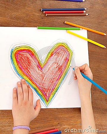 Child`s Hands are Drawing a Heart That. Stock Photo