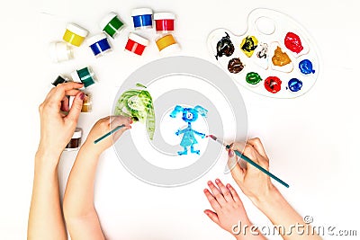 Child`s hands painting a family Stock Photo