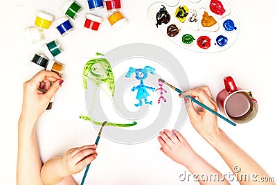 Child`s hands painting a family Stock Photo