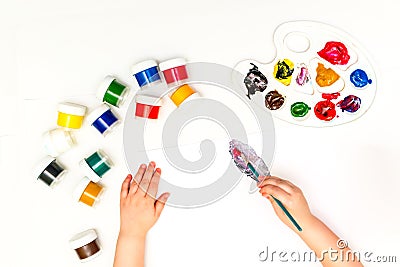 Child`s hands painting a flower Stock Photo