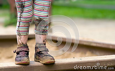 Child's Muddy Feet Stock Photo