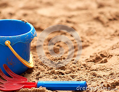 Child's Plastic Bucket and Rake in Sand Stock Photo