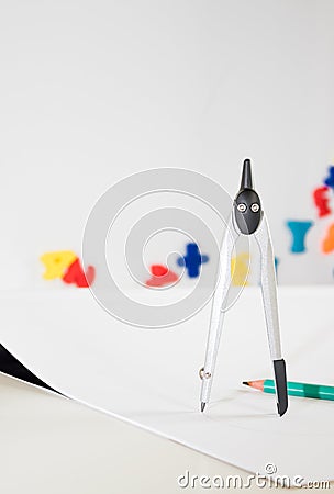 A Child`s School Desk with School Supplies and Compass Stock Photo
