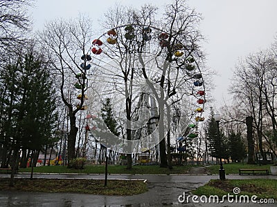 Child`s swing machine on the autumn. A toy car for children in the yard. Stock Photo