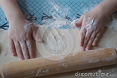 Child sculpts cookies from the dough, hands closeup Stock Photo