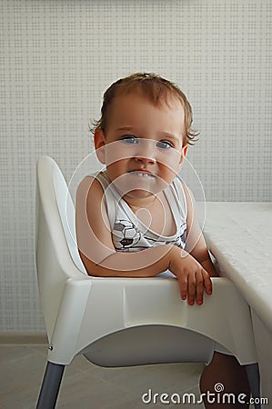 Child seated portrait selective focus Stock Photo