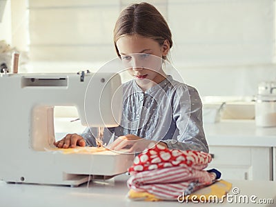 Child sewing Stock Photo