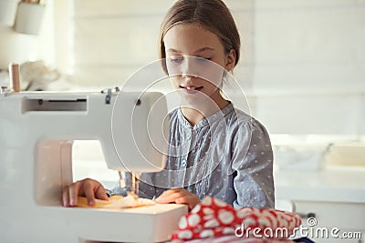 Child sewing Stock Photo