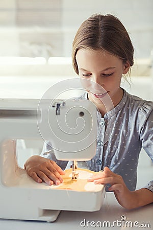 Child sewing Stock Photo