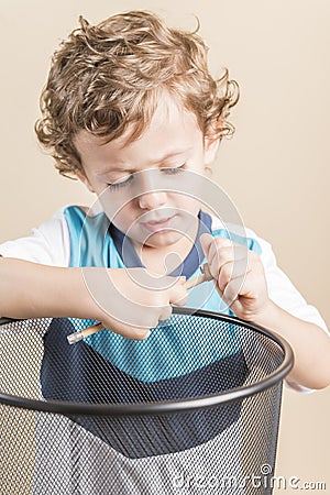 Child sharpening a pencil Stock Photo