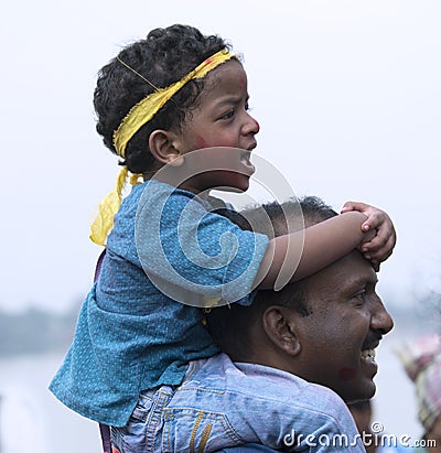 A child shouting with joy at Immersion of Goddess Durga , Kolkata Editorial Stock Photo