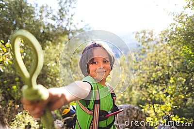 The child shows a knot of rope Stock Photo