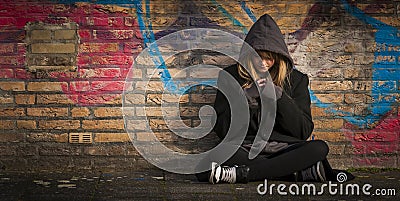 Child sitting alone and thinking Stock Photo