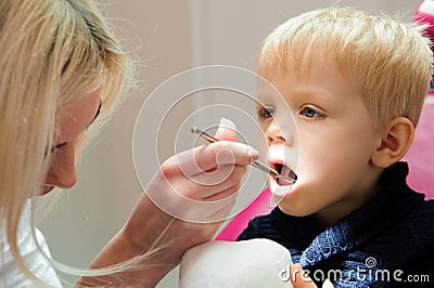 A child sitting in a chair dental, stomatologist. Stock Photo