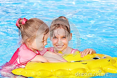 Child sitting on inflatable ring.. Stock Photo