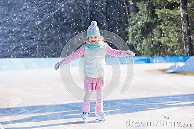 Child skating on natural ice. Kids with skates. Stock Photo