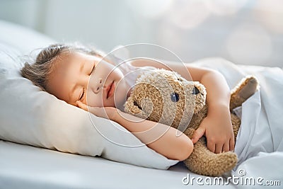 Child is sleeping in the bed Stock Photo