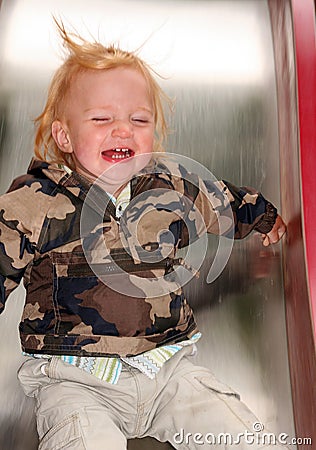 Child on a slide Stock Photo