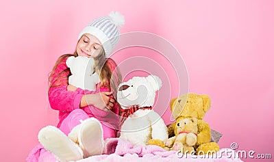 Child small girl playful hold teddy bear plush toy. Why kids love stuffed animals. Kid little girl play with soft toy Stock Photo
