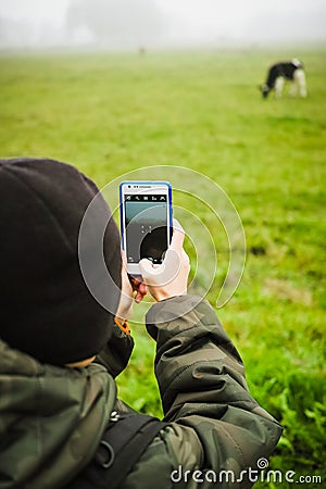 Child with smartphone taking picture Stock Photo