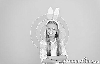 Child smiling play bunny role. Happy childhood. Traditions for kids to help get in easter spirit. Bunny ears accessory Stock Photo