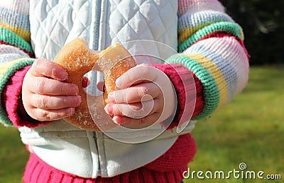 Child snacking on unhealthy chocolate donut Stock Photo