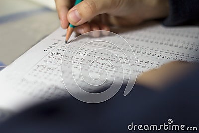Child solves mathematics examples. Stock Photo