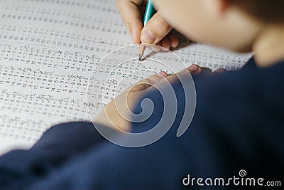 Child solves mathematics examples. Stock Photo