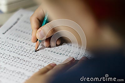 Child solves mathematics examples. Stock Photo