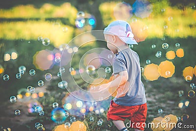 Child in soup burbles background Stock Photo