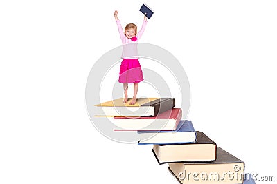 Child on staircase of books Stock Photo