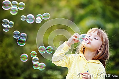 Child starting soap bubbles Stock Photo