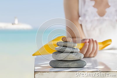 Child, stone and beach Stock Photo