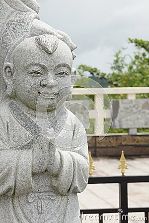Child stone carving at Indonesian Buddhist temple Stock Photo