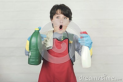 Child stressed with cleaning products Stock Photo