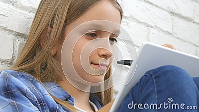 Child Studying on Tablet, Girl Writing for School Class, Learning Doing Homework Stock Photo