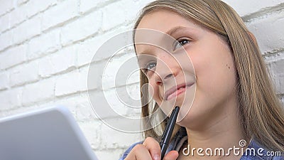 Child Studying on Tablet, Girl Writing for School Class, Learning Doing Homework Stock Photo