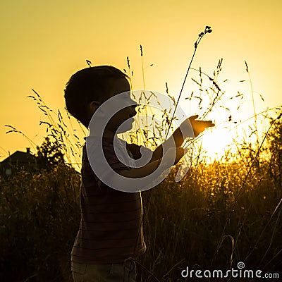 Child sunset silhouette Stock Photo