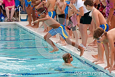 Child Swimmer Jumps Into Pool To Swim Relay Race Editorial Stock Photo