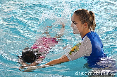Child swimming pool lesson Editorial Stock Photo