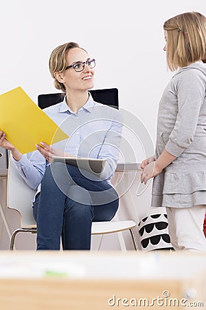 Child talking with speech therapist Stock Photo