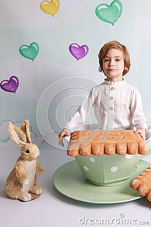 Child in tea cup Stock Photo