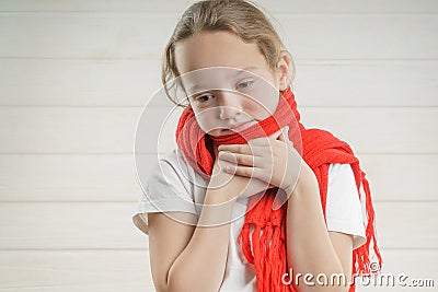 Child temperature. sore throat. bad condition. a child rooting. scarf Stock Photo