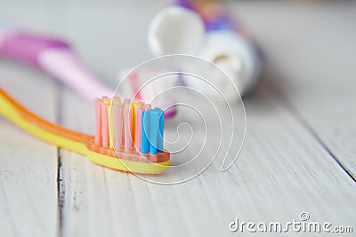 child tooth brush and paste on wooden table Stock Photo