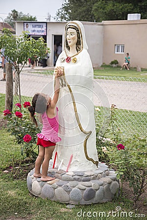 Child touches Mary the Mystical Rose Editorial Stock Photo